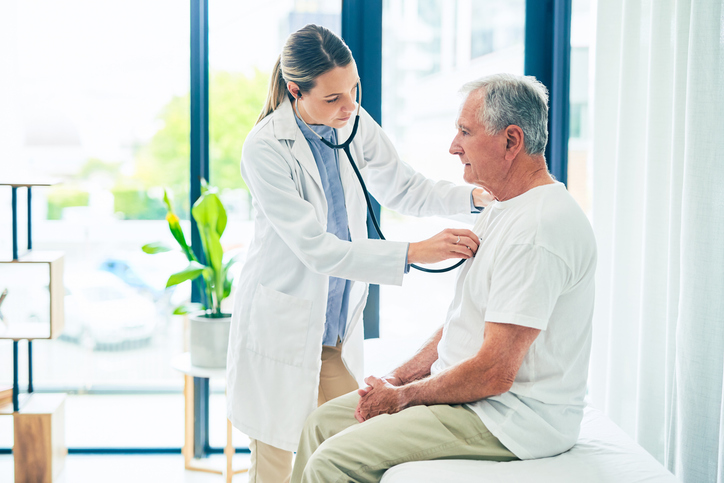 Shot of a female doctor giving a patient a chest exam